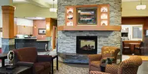 A fireplace in a common room at Pine Ridge